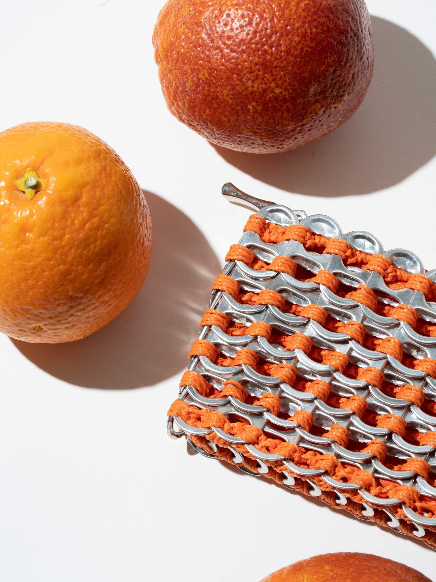 alt="orange coin pouch - pop tab purse escama studio"