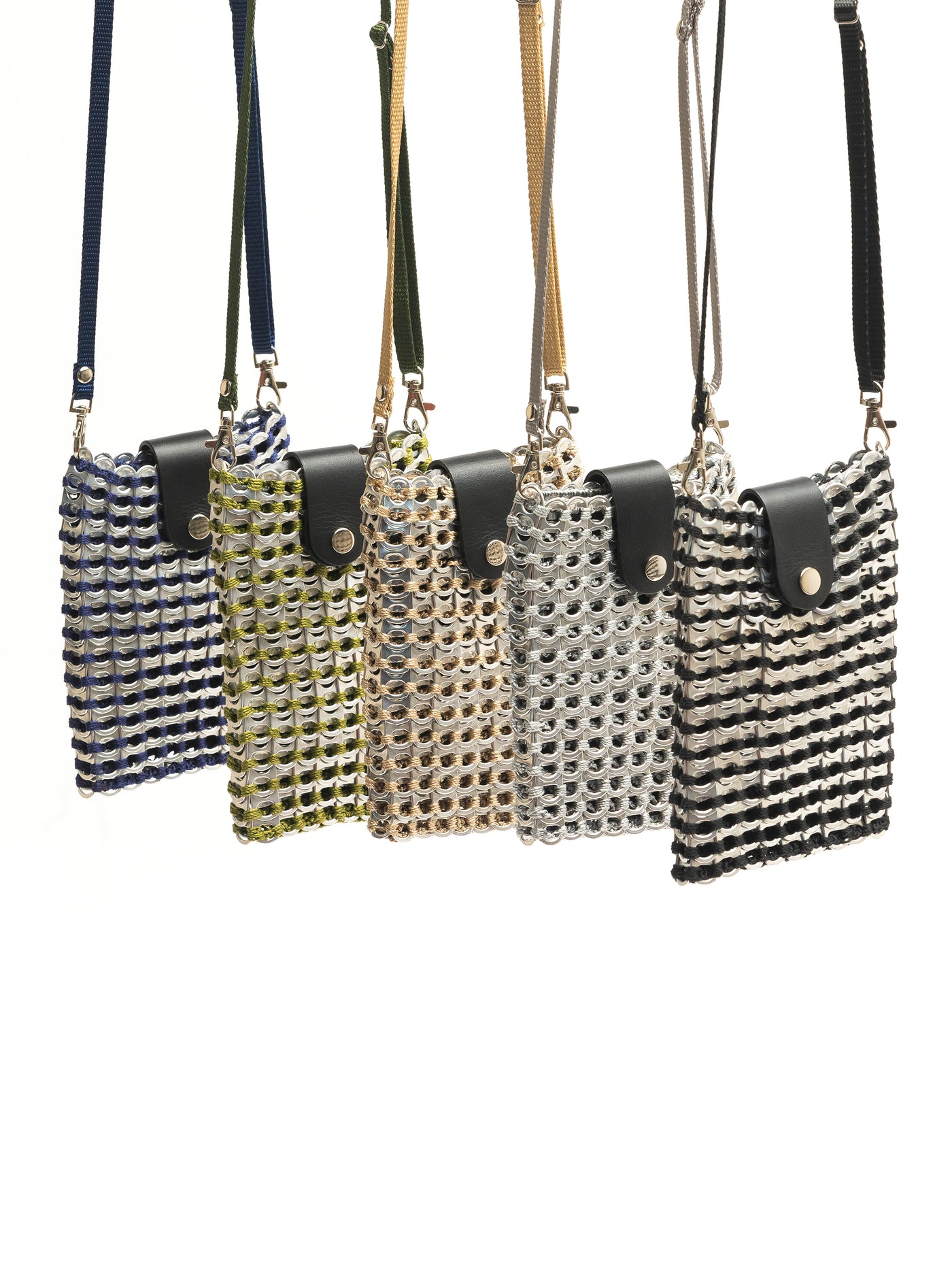 alt="five assorted colored crossbody cell phone bags made of upcycled pop tabs suspended from above - escama studio"