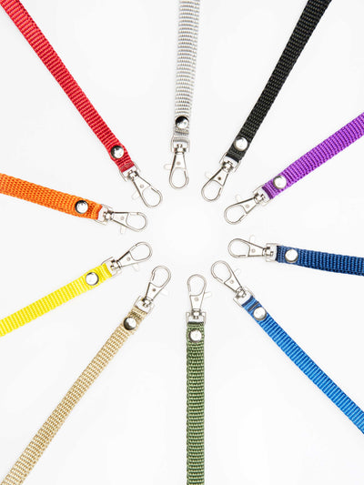 alt="colorful nylon wrist straps for bags - escama studio"