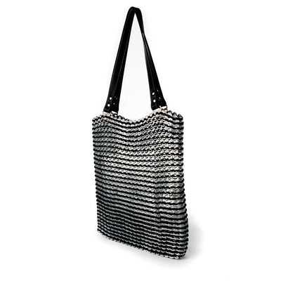 alt="black tote bag with white strips and black leather straps, Luci ring pull bag by Escama Studio"