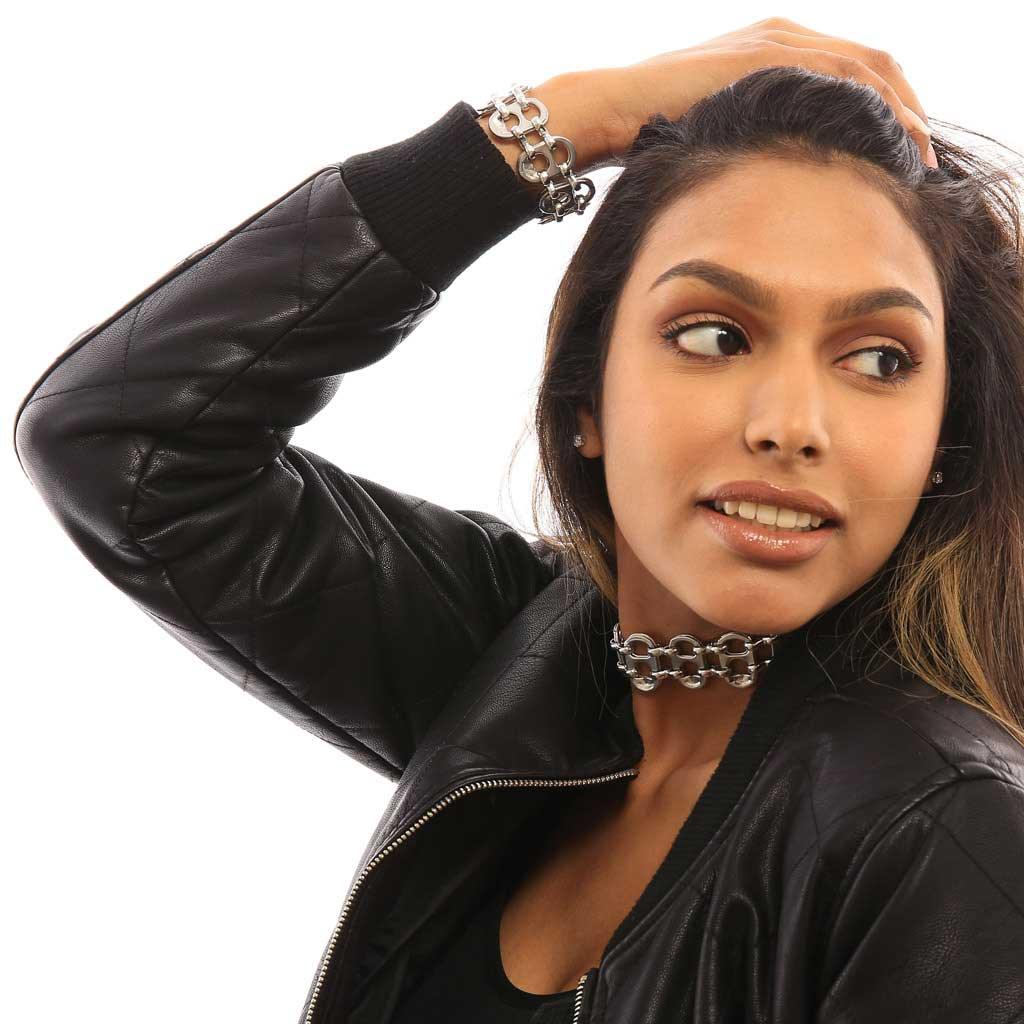 alt="statement jewelry recycled bracelet worn by girl in black leather jacket, Sydney bracelet by Escama Studio"