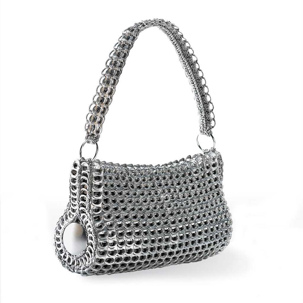alt="cylindar purse made of recycled materials - escama studio"