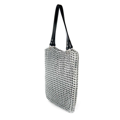 alt="woven tote bag silver color with zipper top and black leather shoulder straps, Luci ring pull bag Escama Studio"