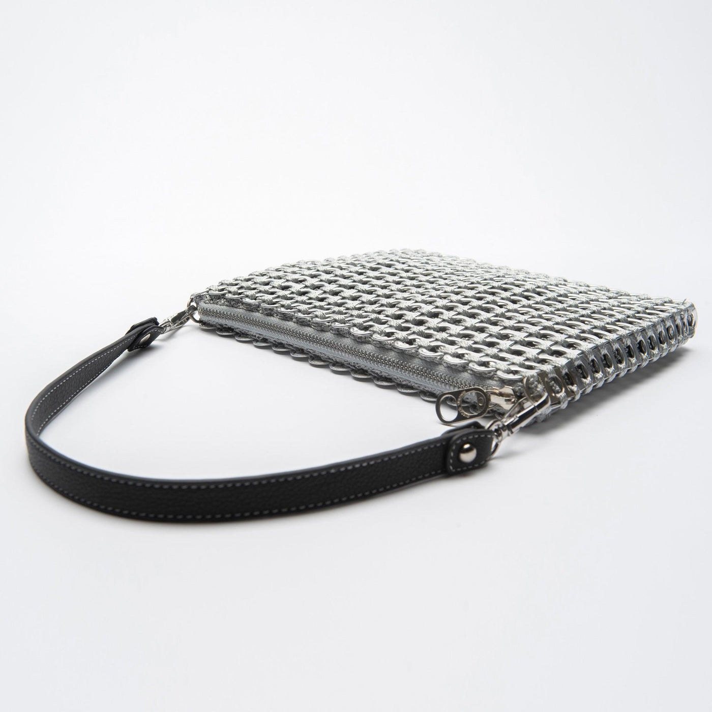 alt="silver woven bag with leather strap - jamie bag escama studio"