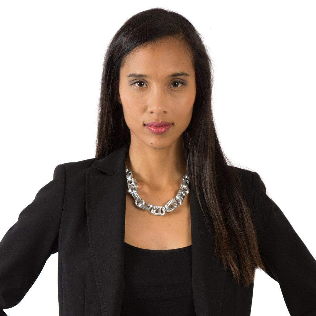 pop tab necklace worn by woman in black jacket escama studio